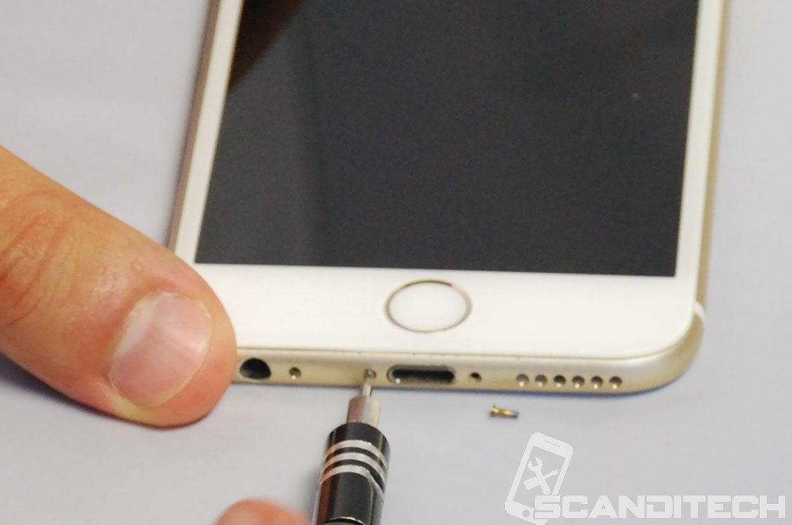iPhone 6S battery replacement guide - Removing bottom screws.