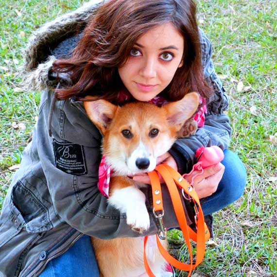 Girl Holding Dog With Harness girl holding dog with harness