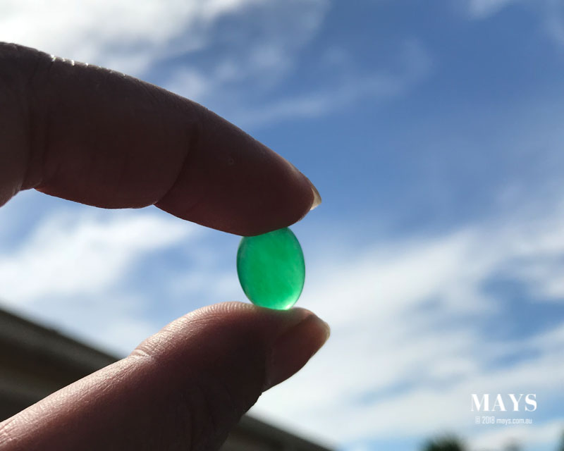 Flawless Jadeite jade A green gemstone held in the sky