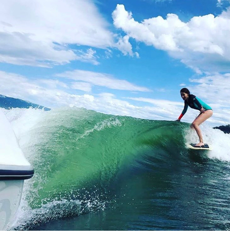 NautiCurl skim style wakesurf board and huge wave