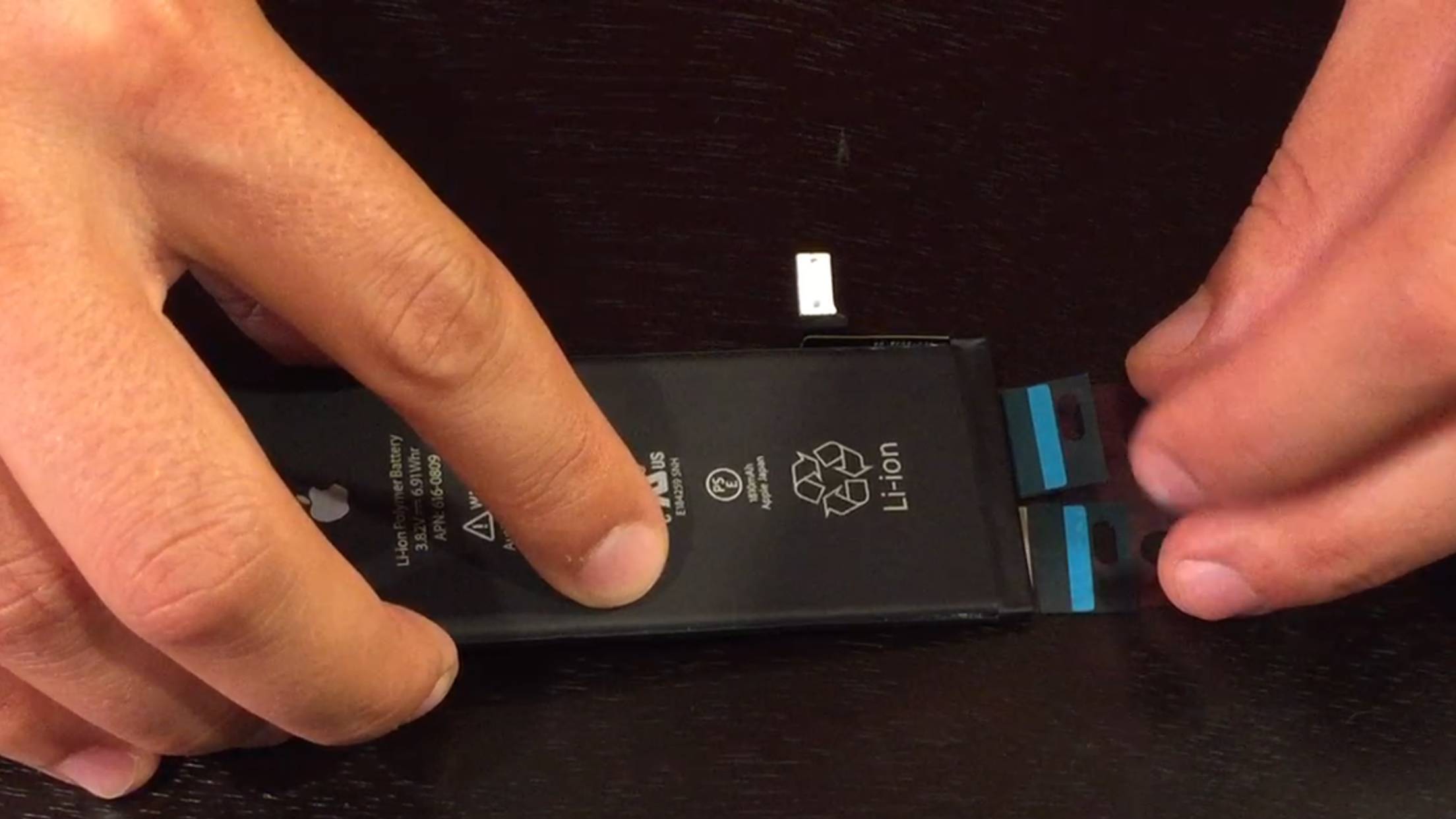 iPhone 5S/5C battery replacement guide - aligning the adhesive