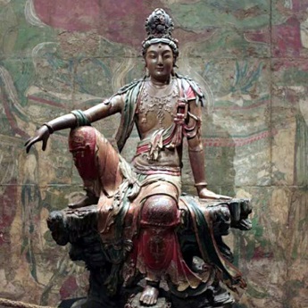 An ancient Chinese Buddha statue: Guanyin of the Southern Seas Time An ancient Chinese Buddha statue: Guanyin of the Southern Seas Time
