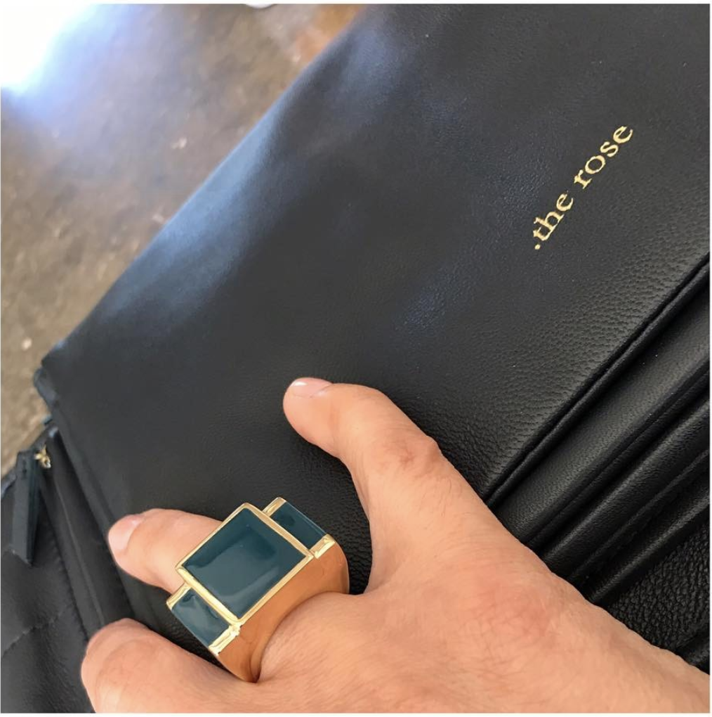 The Rose hand with a black ring