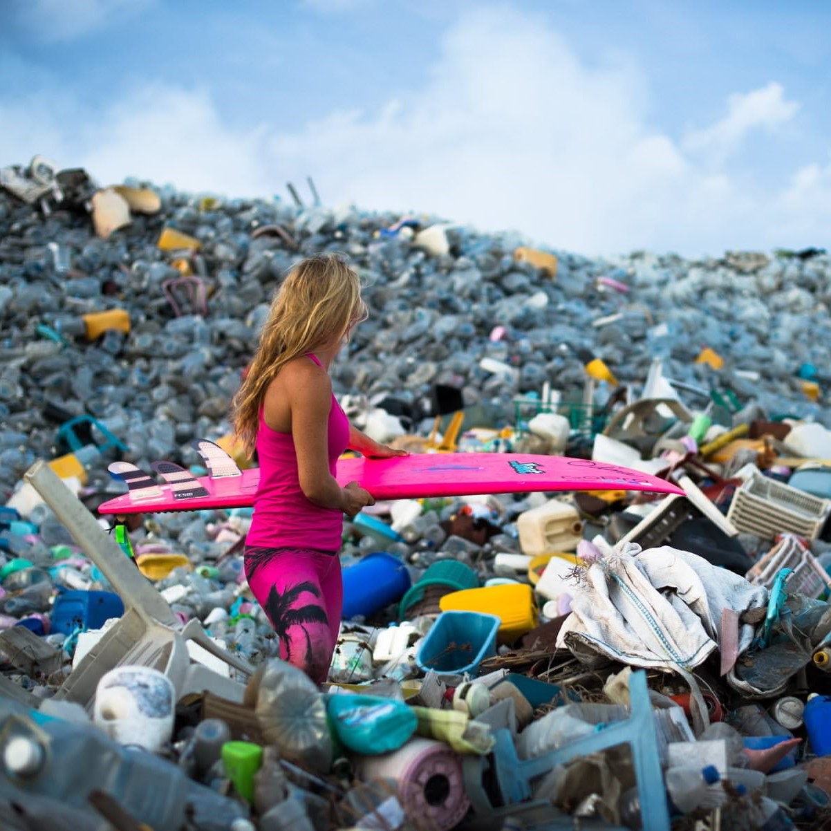 Surfing and beach with plastic bottles 