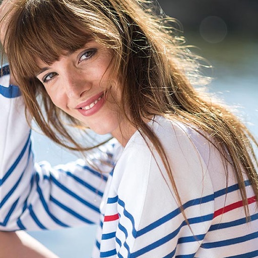 saint James, made in France Woman smiling with French stripes
