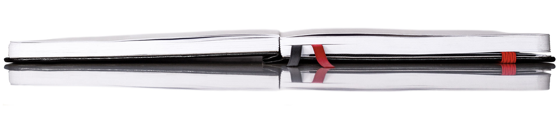 sidekick daily goal planner lays flat design with black and red bookmarks